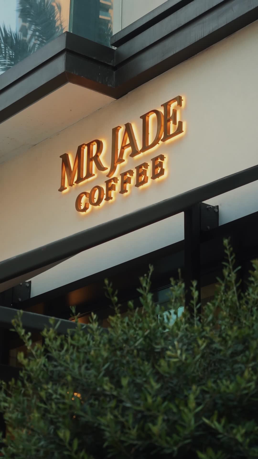 MRJADE Coffee storefront at dusk, Downtown Dubai